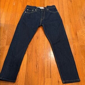 Levi's 511 Slim Fit model in a dark blue wash